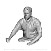 A loco driver seated operating a regulator