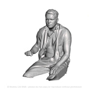 A loco driver seated operating a regulator