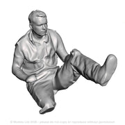 A loco driver seated operating a regulator