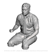 A loco driver seated operating a regulator