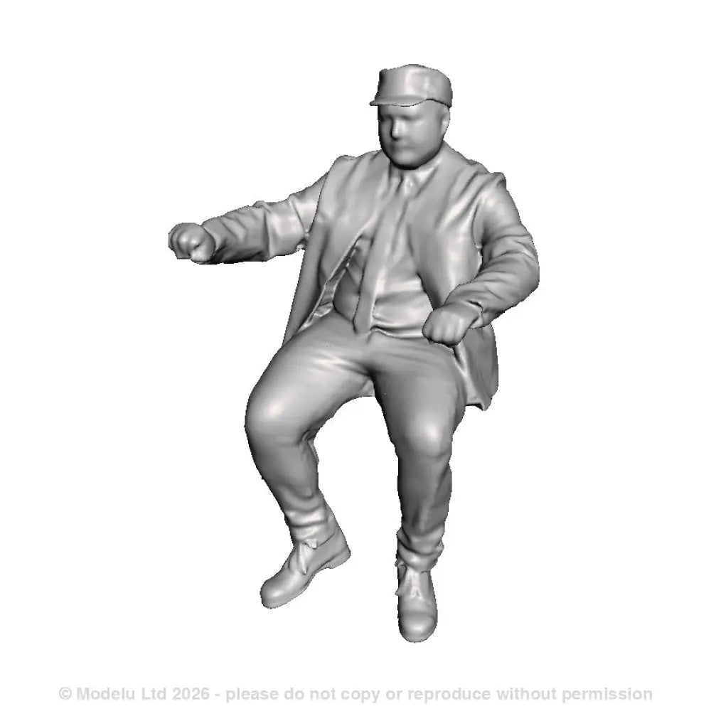 A loco driver seated operating a regulator