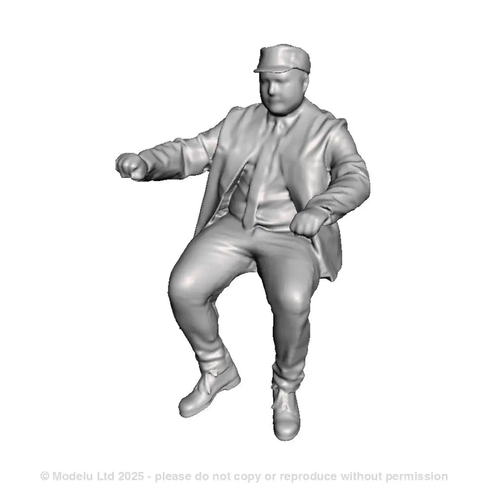 A loco driver seated operating a regulator