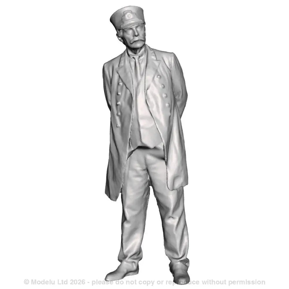 A station master with hands behind his back