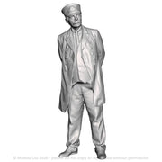 A station master with hands behind his back