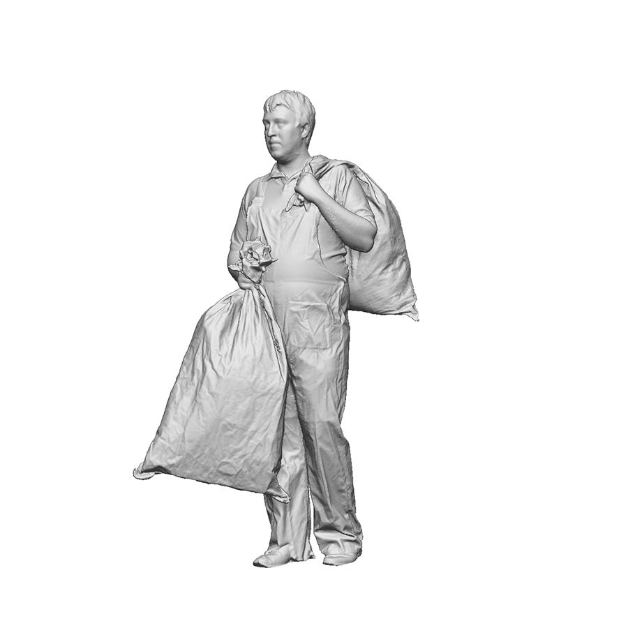 A Royal Mail worker carrying a mail bag