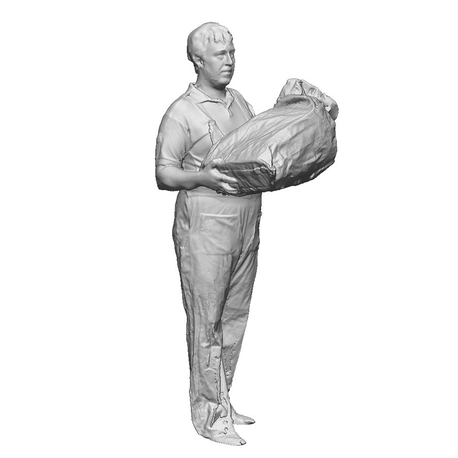 A Royal Mail worker handling a mail bag