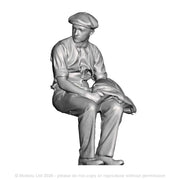 A workman seated with jacket