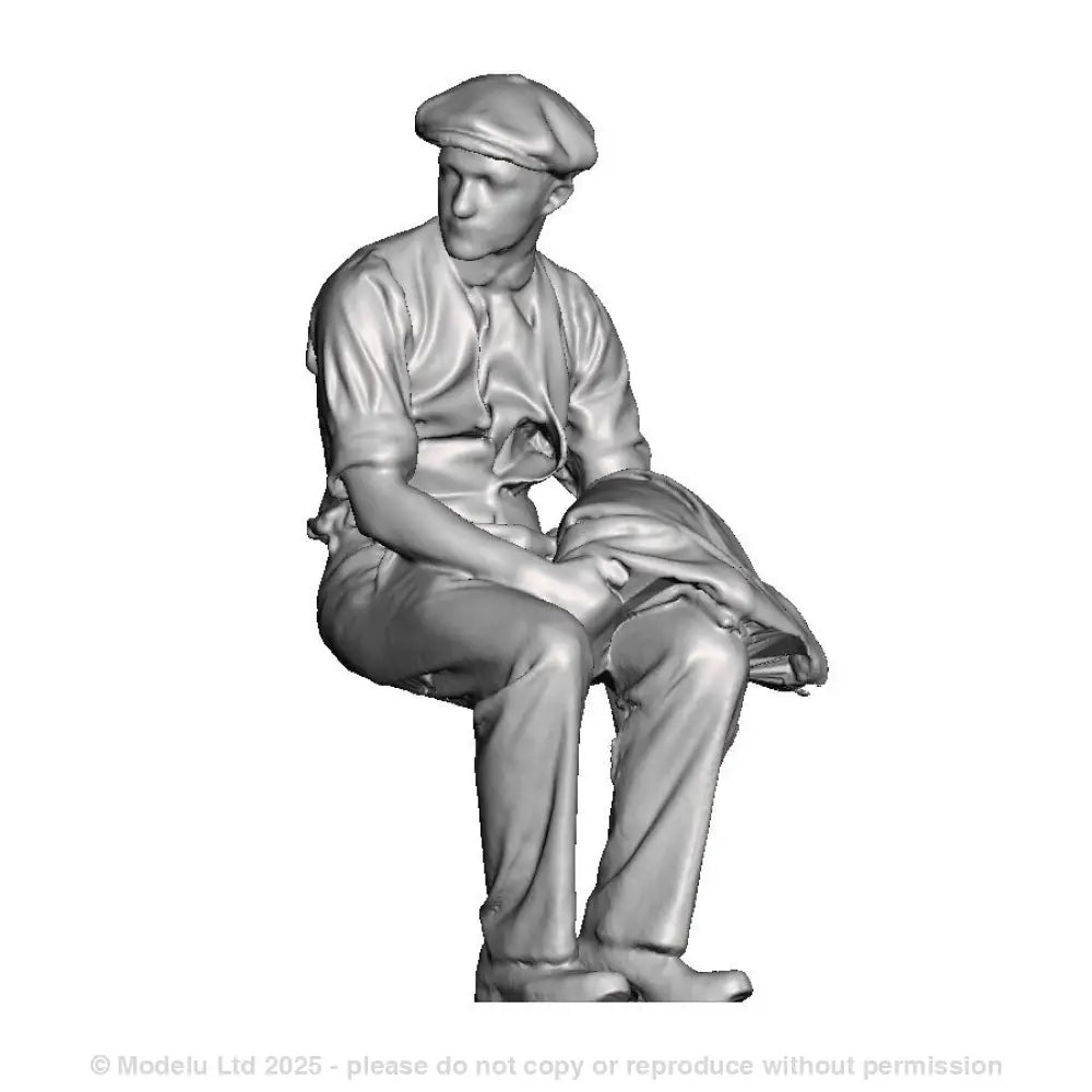 A workman seated with jacket