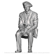 A workman seated