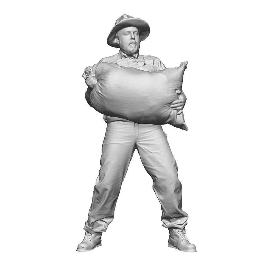 A mill worker lifting a sack