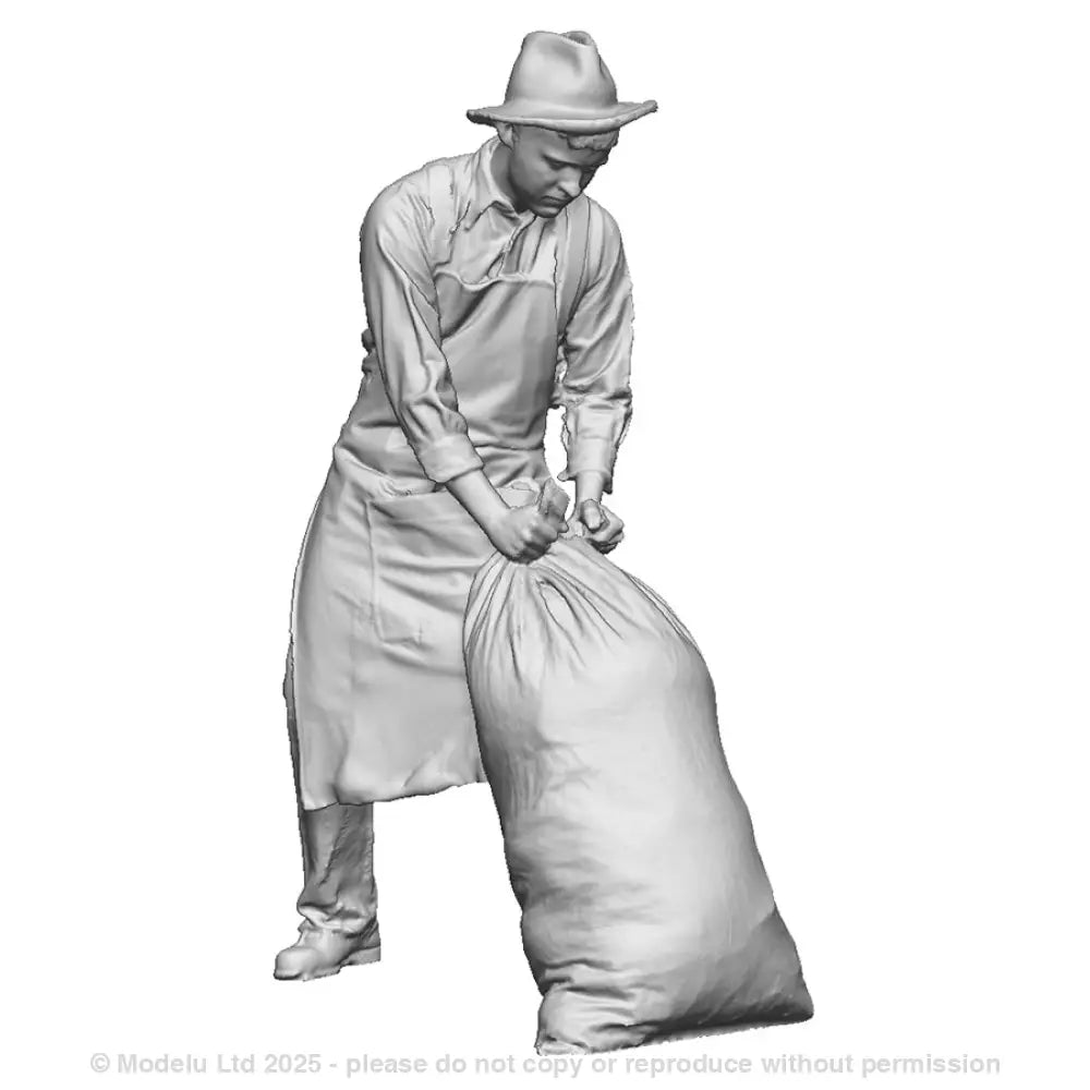 A mill worker moving sack
