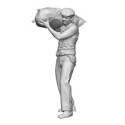 A mill worker carrying sack