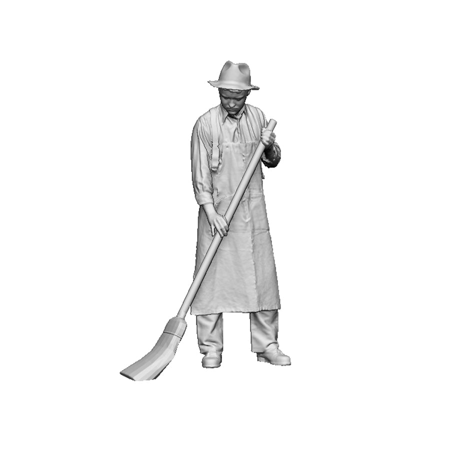 A mill worker sweeping
