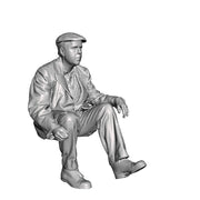 A workman seated