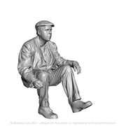 A workman seated