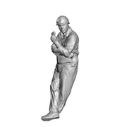 A miner leaning eating a sandwich