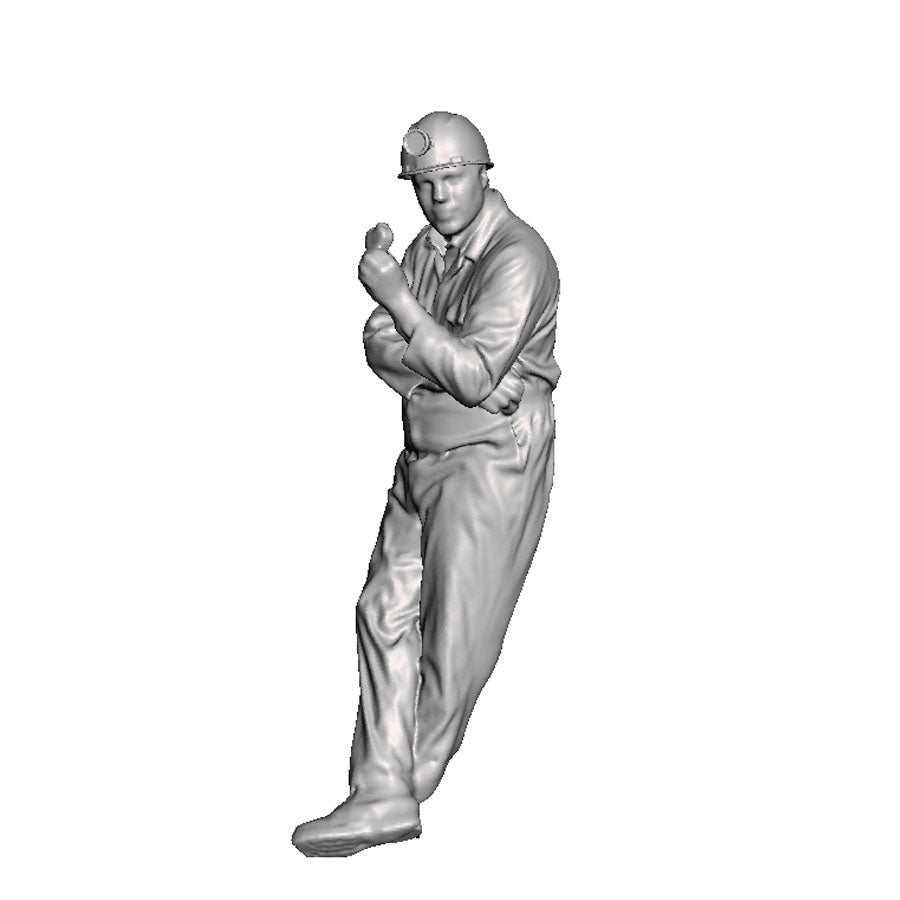 A miner leaning eating a sandwich