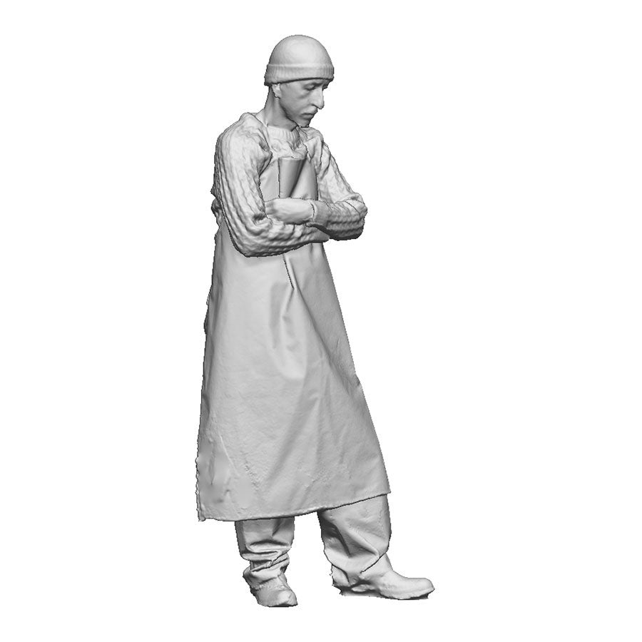 A fisherman with arms folded