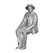 A male figure wearing boater hat seaeted
