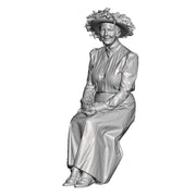 A female figure in large hat seated