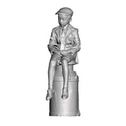 A boy sat on a milk churn