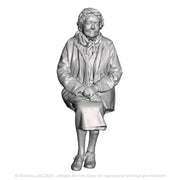 A female figure seated