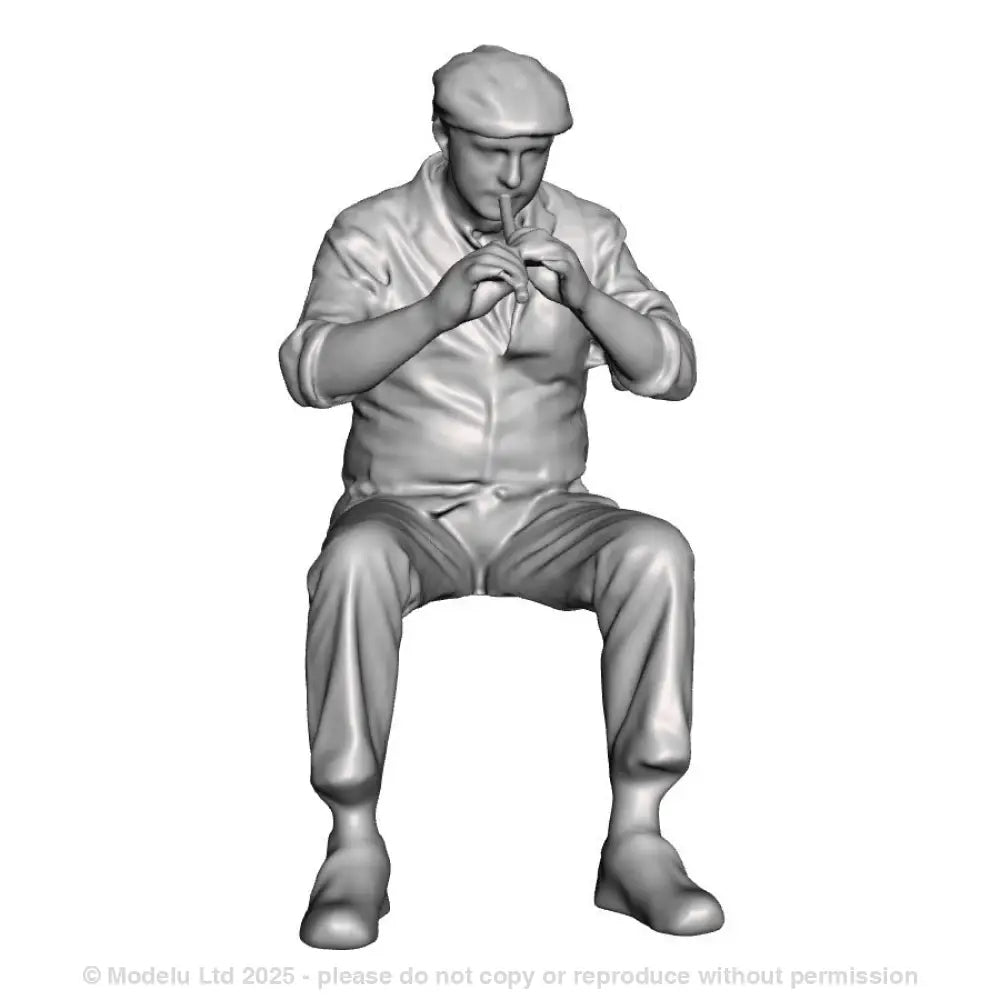 A male whistle player seated