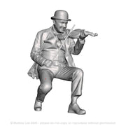 A male fiddle player seated