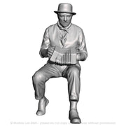 A male concertina player seated