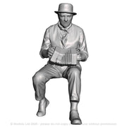 A male concertina player seated