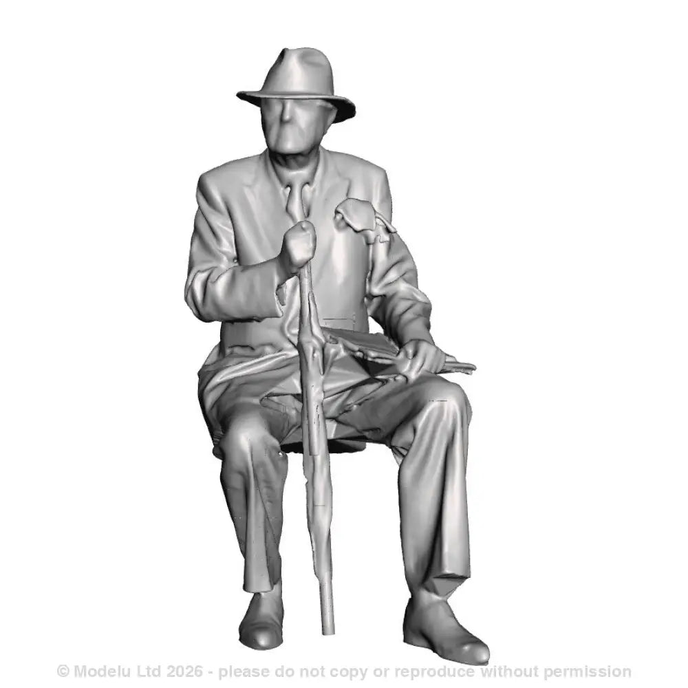 A male figure seated with umbrella