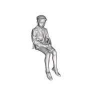 A school boy seated