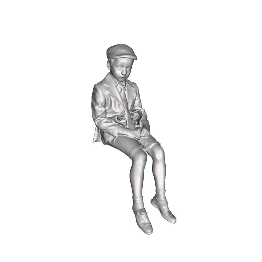 A school boy seated