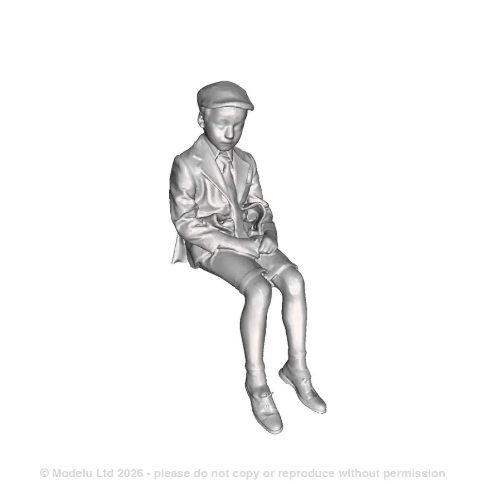 A school boy seated