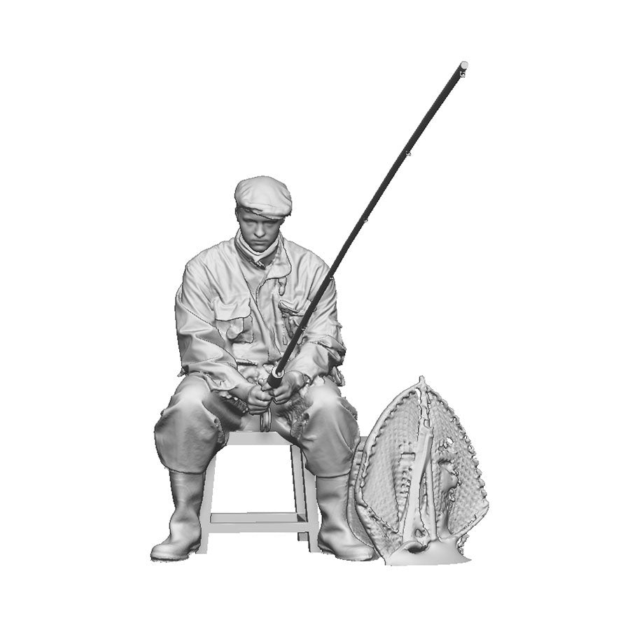 A male angler seated
