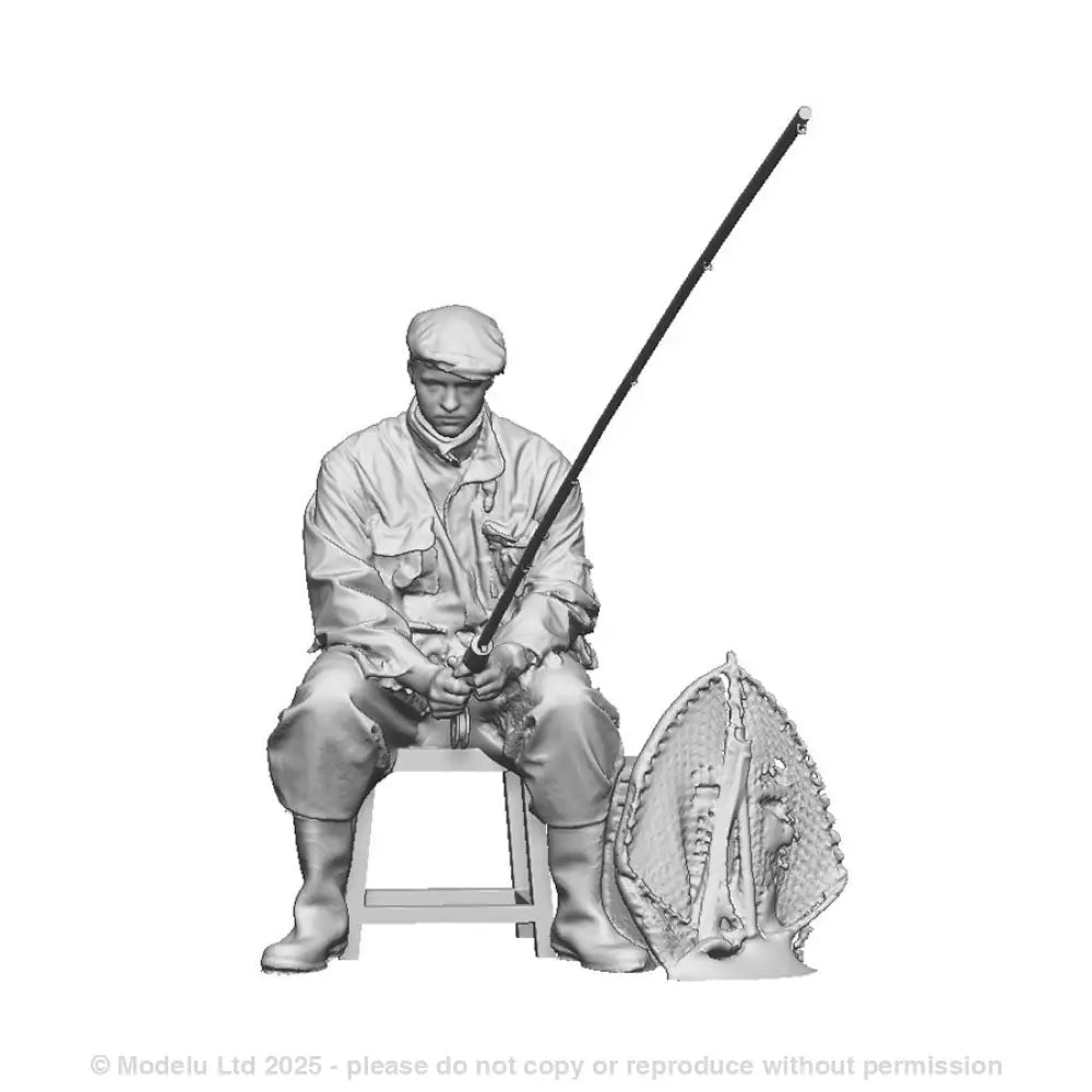 A male angler seated