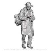 A male trainspotter with book