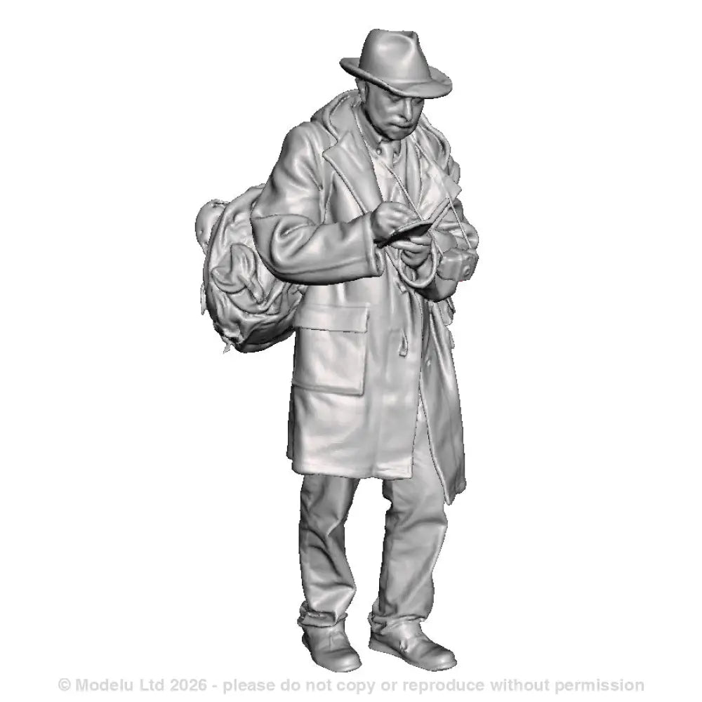 A male trainspotter with book