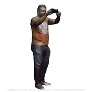 A male figure using a mobile phone