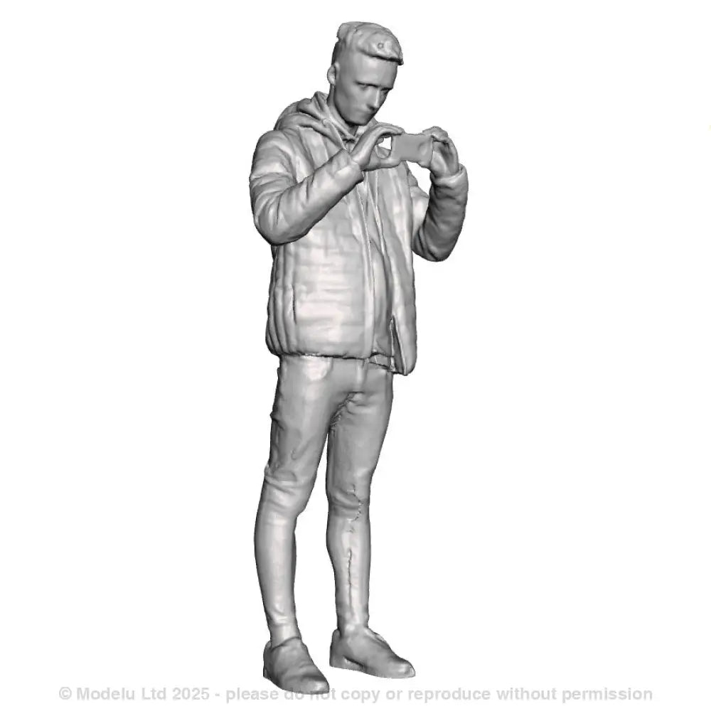 A male figure using a mobile phone