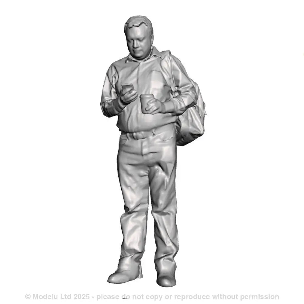 A male figure using a mobile phone