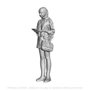 A female figure using an ipad
