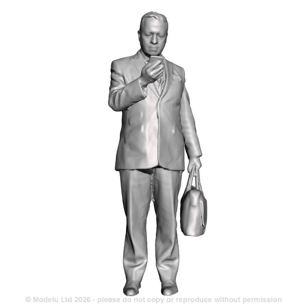 A male figure using a mobile phone