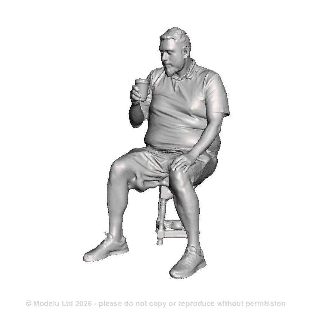 A male figure seated drinking