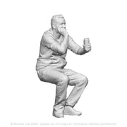 A male seated figure with drink