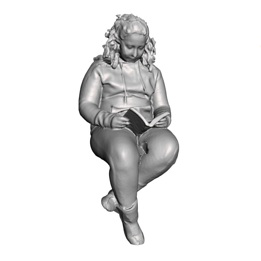 A female figure seated with book