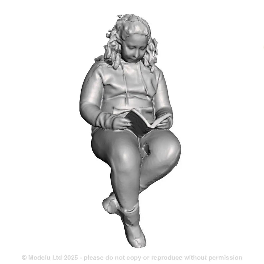 A female figure seated with book