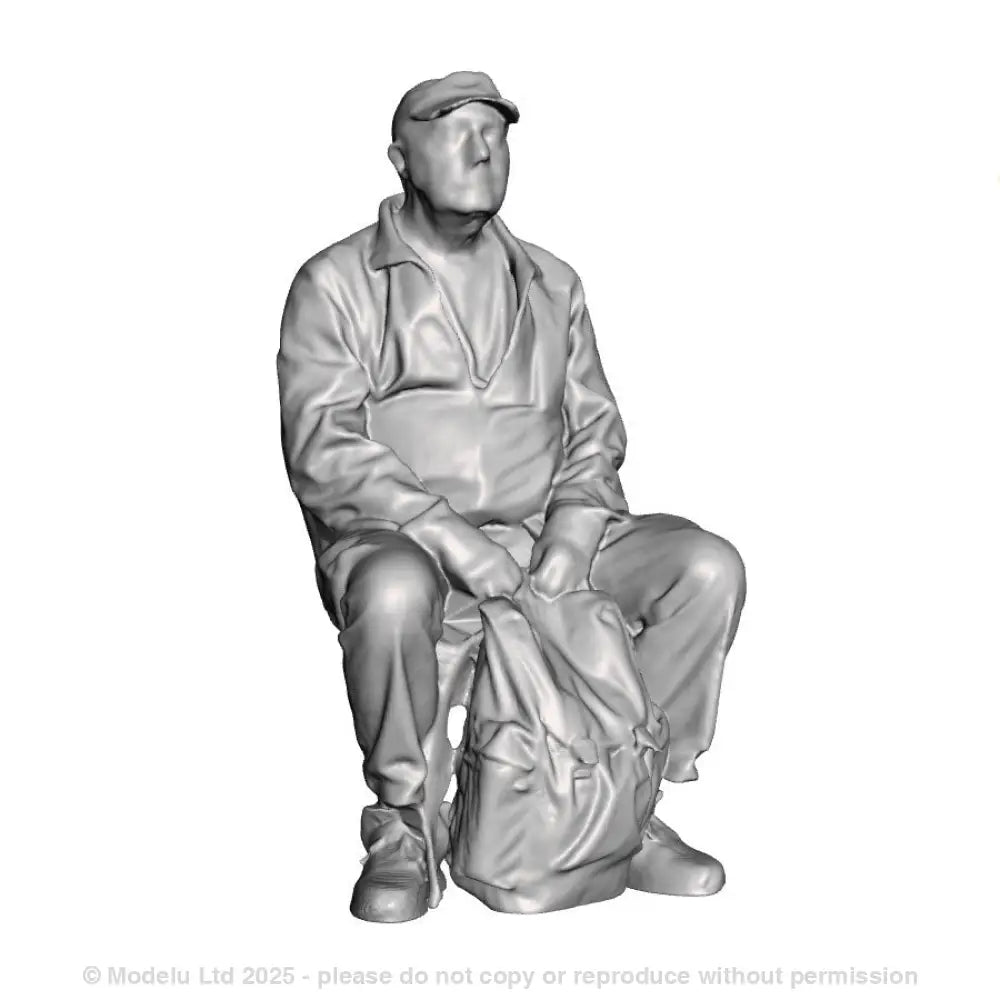 A male figure seated with rucksack