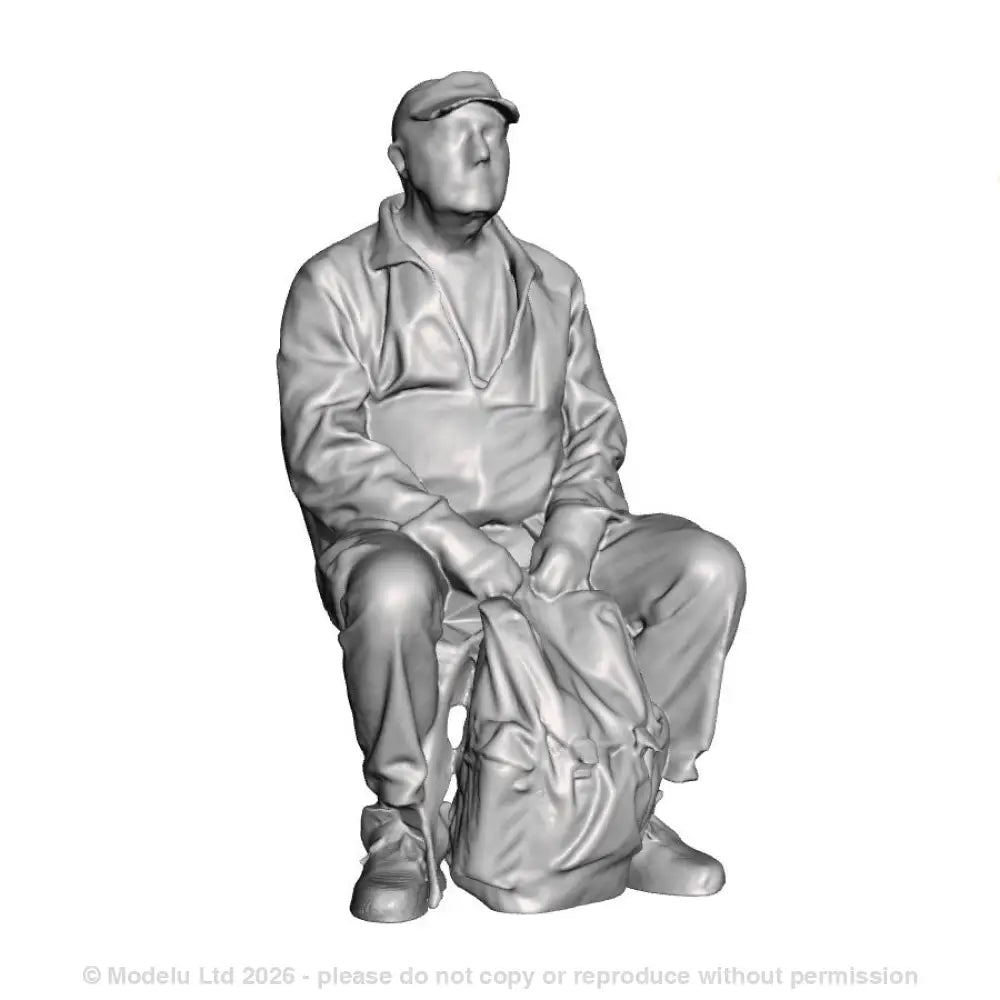 A male figure seated with rucksack