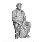 A male figure seated with rucksack